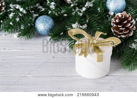 festive beautiful christmas background with gift boxes balls and christmas tree branches on white wooden background copy space