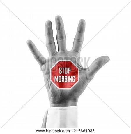 Stop mobbing concept. Businessman or human resources officer with open hand with stop street sign and text Stop Mobbing.