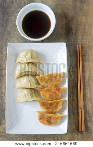 Eight Boiled Or Fried Jiaozi Or Gedza Served With Soy Sauce.