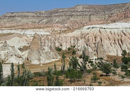 Colorful Rose valley mountain with blue sky in Cappadocia Red canyon in Goreme village Turkey. Popular tourist destination in Turkey for trekking.