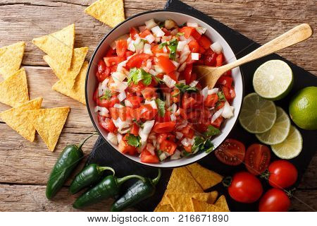 Pieces Of Chicken Stew With Potatoes, Peppers, Tomatoes, Peas And Onions Close-up. Vertical Top View