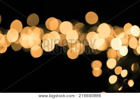 Abstract gold sparkle on black background. Christmas concept
