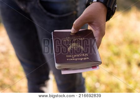Passport in hand Woman.Passport in hand.Passport in hand Woman.Passport in hand.