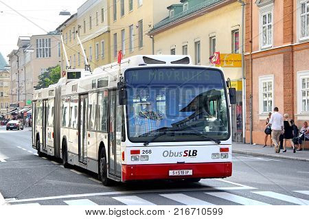 Salzburg Austria - July 28 2014: Articulated trolleybus Van Hool AG300T in the city street.