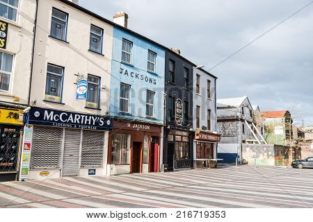 Cork, Ireland - November 12, 2017: Old vintage stores in Cornmarket Street in city center of Cork