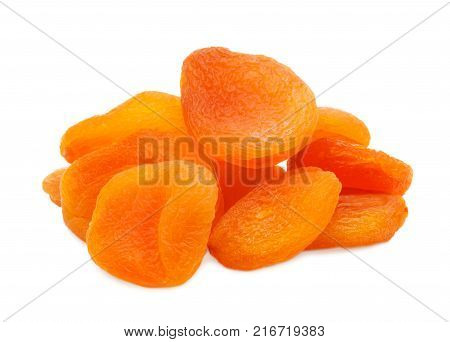 A pile of dried delicious apricot, dried apricots, lying close up, isolated on a white background.