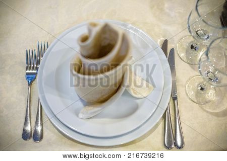 Utensils on a table napkin at the top view image.
