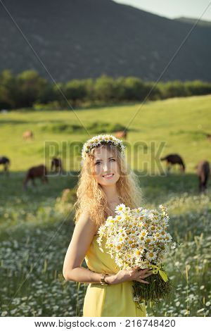 Beautiful Lady With Cute Daughter On Camomile Field Full Of Flowers