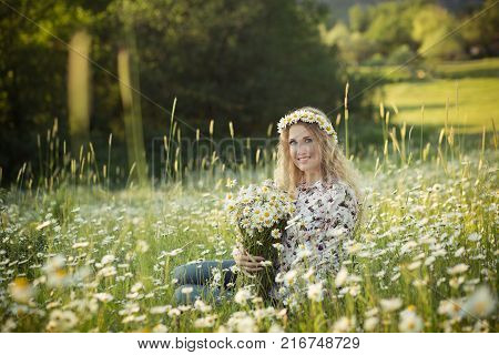 Beautiful Lady With Cute Daughter On Camomile Field Full Of Flowers