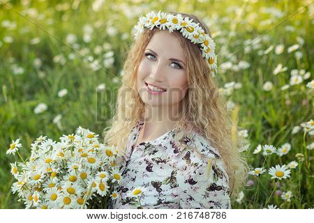 Beautiful Lady With Cute Daughter On Camomile Field Full Of Flowers