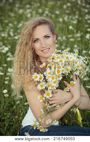 Beautiful Lady With Cute Daughter On Camomile Field Full Of Flowers