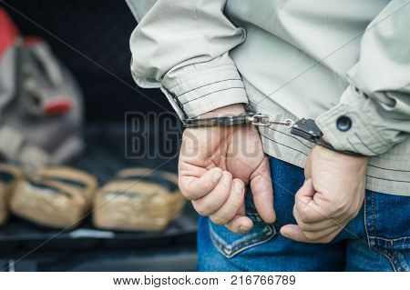 A Man In Handcuffs Detained The Transportation Of Drugs. Crime.