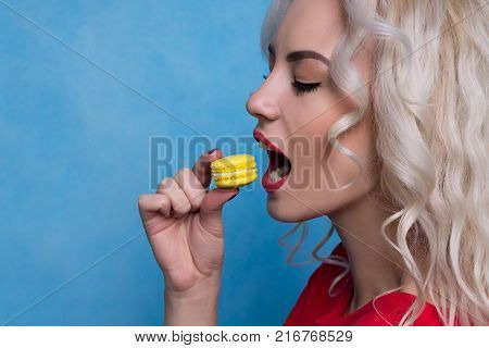 Beautiful Girl with a Bright Dessert in the Studio