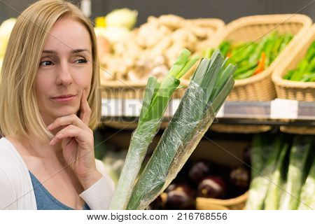 A Woman in a Vegetable Shop Makes a Choice