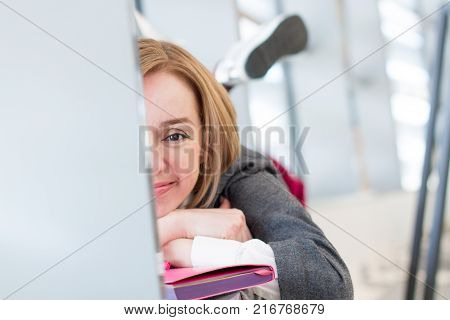 Happy Modern Woman with a Notebook. Copy Space