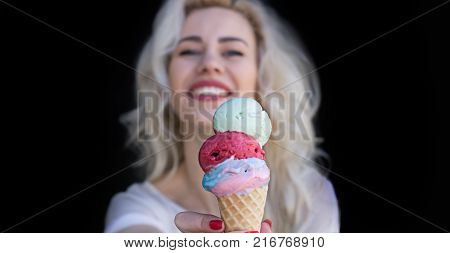 Beautiful Girl with Ice Cream Isolated on Black Background. Copy Space