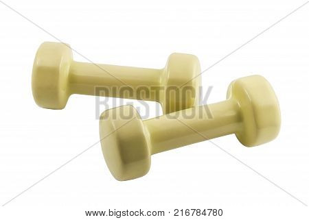 pair of light yellow dumbbells for fitness isolated