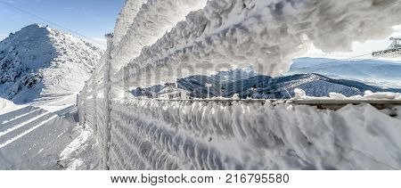 Cold snowy winter in Low Tatras mountains. Hill Chopok cottage Kamienka and cablewy at background Slovakia