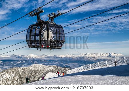 JASNA SLOVAKIA - DECEMBER 2: Ropeway Funitel and skiers on hill Chopok in resort Jasna in Low Tatras mountains on December 2 2017 in Jasna