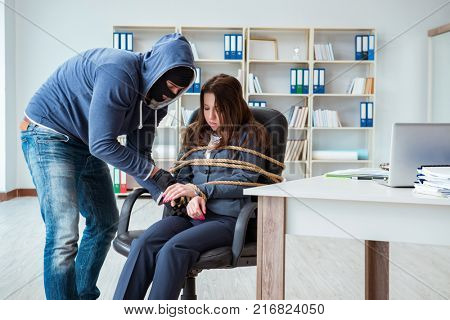 Criminal taking businesswoman as hostage in office