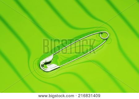 Physical experiment - pin floating on water surface.