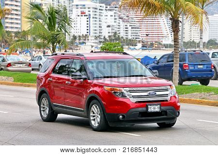 Acapulco Mexico - May 30 2017: Red motor car Ford Explorer in the city street.