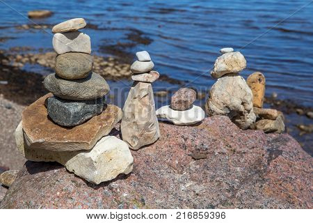 Zen balance of stones at rocky seashore