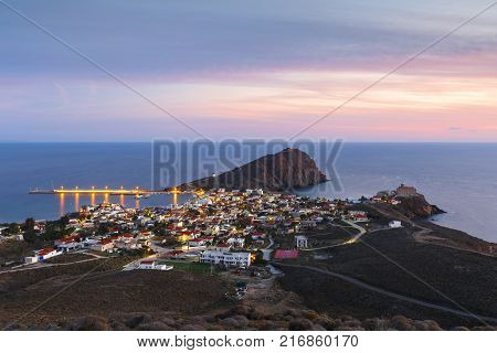 Image of Psara's main village and harbour at sunset.