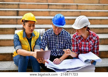 Business Concepts Engineering Professional engineers Young Business people are planning construction.