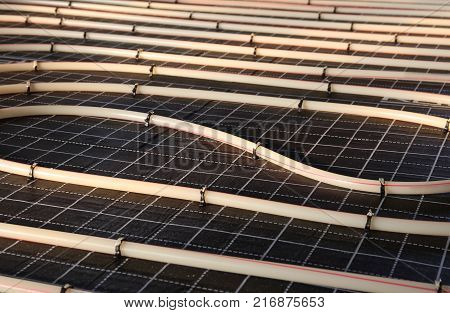 Construction of house. Tubing are elements of radiant floor heating system