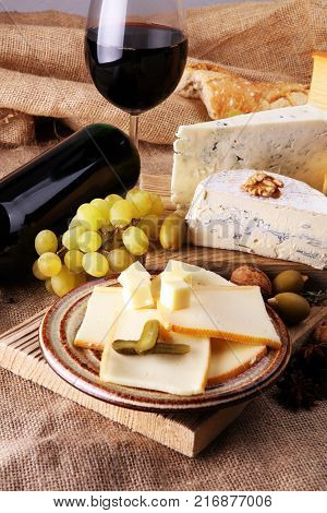 various types of cheese on rustic wooden table