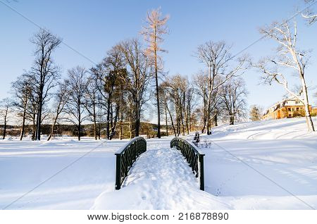 Wooden footbridge on a snow covered landscape next to Bogstadvannet lake area