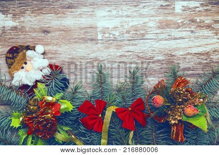 Vintage christmas background. Fir tree branches on old boards. New Year background. Xmax background. Christmas tree. Toned image. Vintage image.