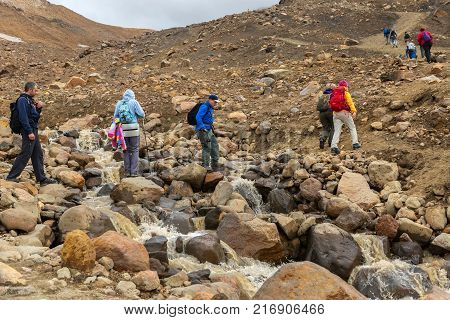 Kamchatka Peninsula, Russia - August 26, 2016: Tourists during the ascent to the active volcano Mutnovsky in Kamchatka.