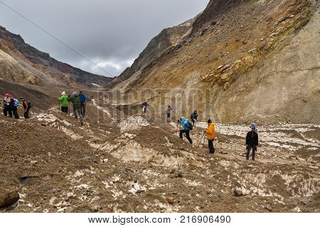 Kamchatka Peninsula, Russia - August 26, 2016: Tourists during the ascent to the active volcano Mutnovsky in Kamchatka.