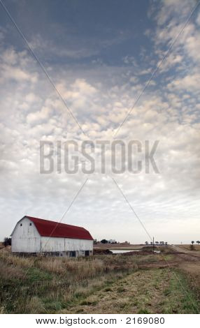 Barn Under A Cloudy Sky