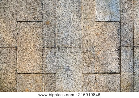 Background of sidewalk of pedestrian walkway using block of non slippy surface stone