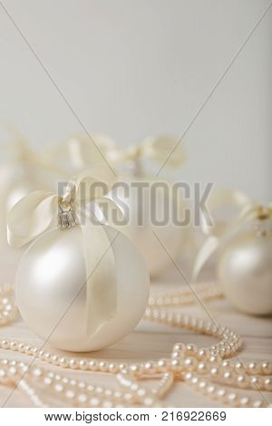 Christmas and New Year. Christmas tree white toys with ribbon. Selective focus.