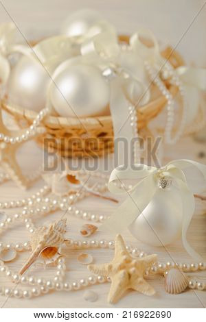 Christmas and New Year. Christmas tree white toys with ribbon. Selective focus.