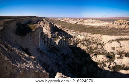 Panorama view to Aral sea from the rim of Plateau Ustyurt at sunset in Karakalpakstan Uzbekistan