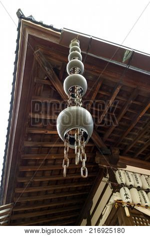 Kanazawa - Japan, June 9, 2017: Bronze rain drain at the the Oyama jinja Shrine as a functional decoration 