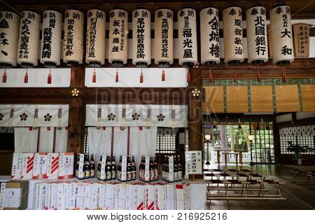 Kanazawa - Japan, June 9, 2017: Interior of the Oyama jinja Shrine with lanterns and bottles of sake as a gift to the shrine