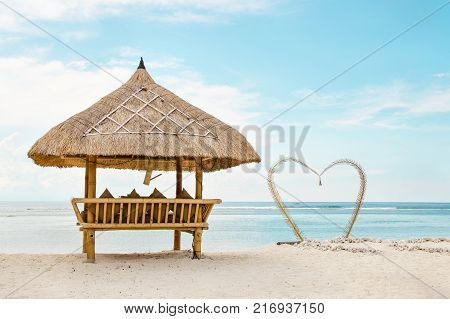 wooden shelter from the sun on the romantik beach in Bali. Stock image.