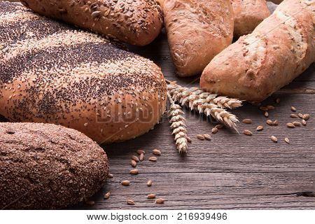 Bread and bakery products on a wooden desk.