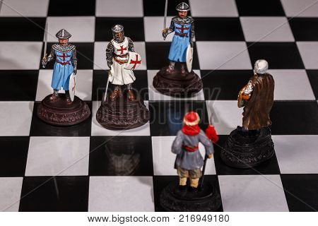 Chess pieces on a Board with black-and-white field.