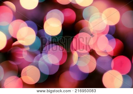 Bright christmas eve background. Plenty of golden sparkling bokeh from defocused garland lights. Backdrop for design