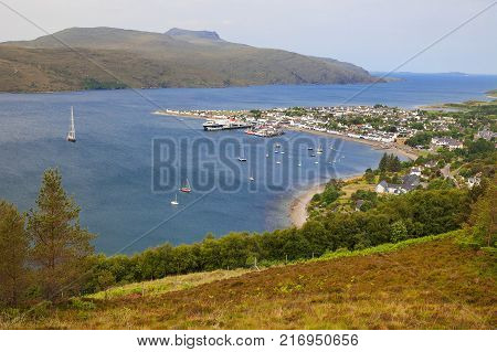 Ullapool, Scottish Highlands, Scotland, United Kingdom. Quaint Village And Loch Broom, Beneath Mountain Range