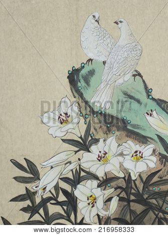 two white doves and a lily flower