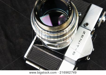 DONETSK, UKRAINE - May 07, 2016: old soviet film SLR camera Zenit - B with lens Jupiter-11, for use with 35 mm film, made in USSR in 1968 - 1973, manufactured by KMZ, with original leather case