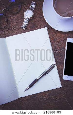 Blank Paper Book On the wood working table Warm coffee Wait for creative time to start papeer blank for text background